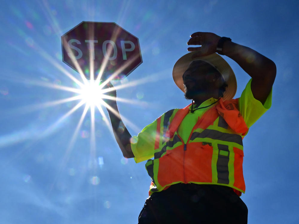 Traffic warden Rai Rogers mans his street corner during temperatures as high as 106 in Las Vegas, Nevada on Wednesday.