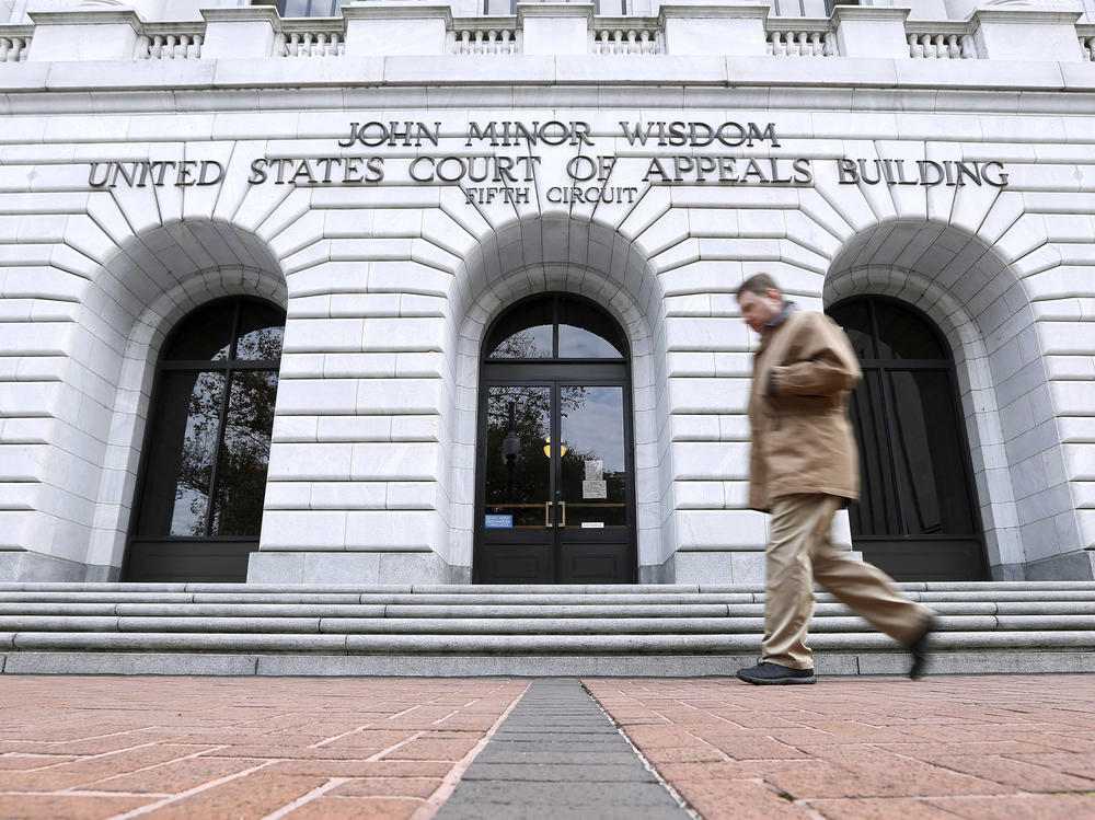 A man walks in front of the 5th U.S. Circuit Court of Appeals on Jan. 7, 2015, in New Orleans.
