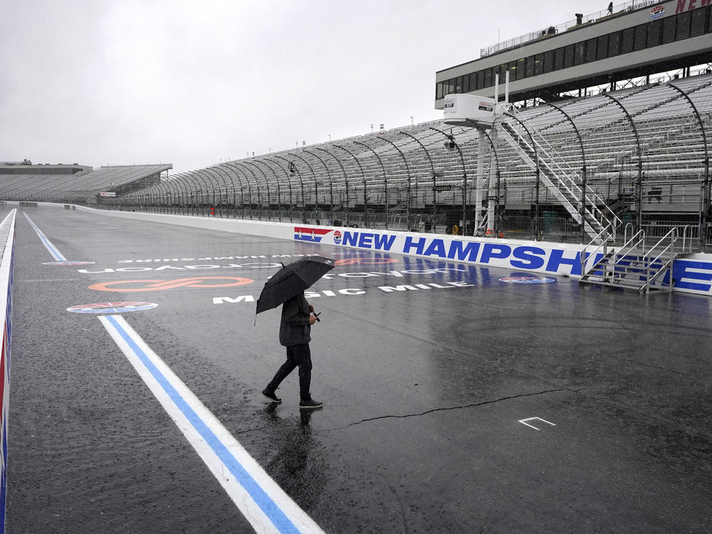 The Crayon 301 NASCAR Cup Series race at New Hampshire Motor Speedway in Loudon (pictured) was canceled Sunday and postponed until Monday due to inclement weather.