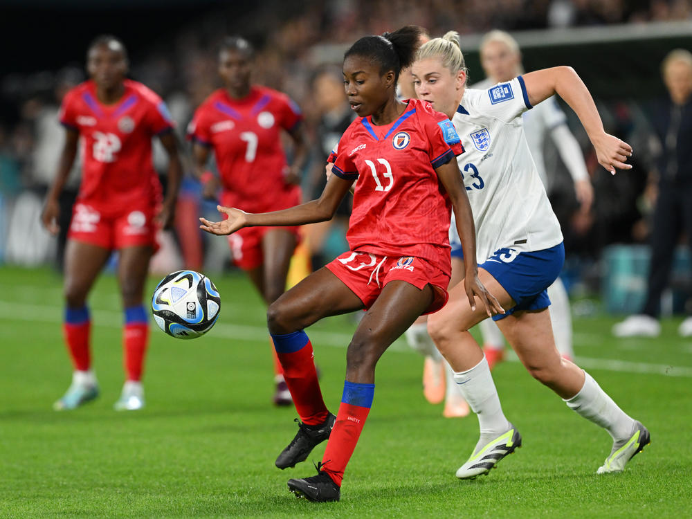 Betina Petit-Frere of Haiti controls the ball against Alessia Russo of England during the teams' opening game at the Women's World Cup in Brisbane, Australia on July 22, 2023. Haiti is one of eight newcomers at the tournament this year.