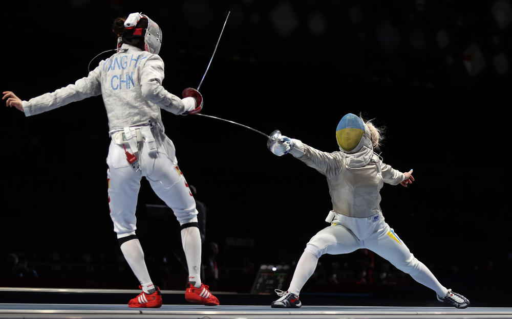 Olga Kharlan of Team Ukraine, right, competes against Hengyu Yang of Team China at the Tokyo Olympic Games at Makuhari Messe on July 26, 2021 in Chiba, Japan.