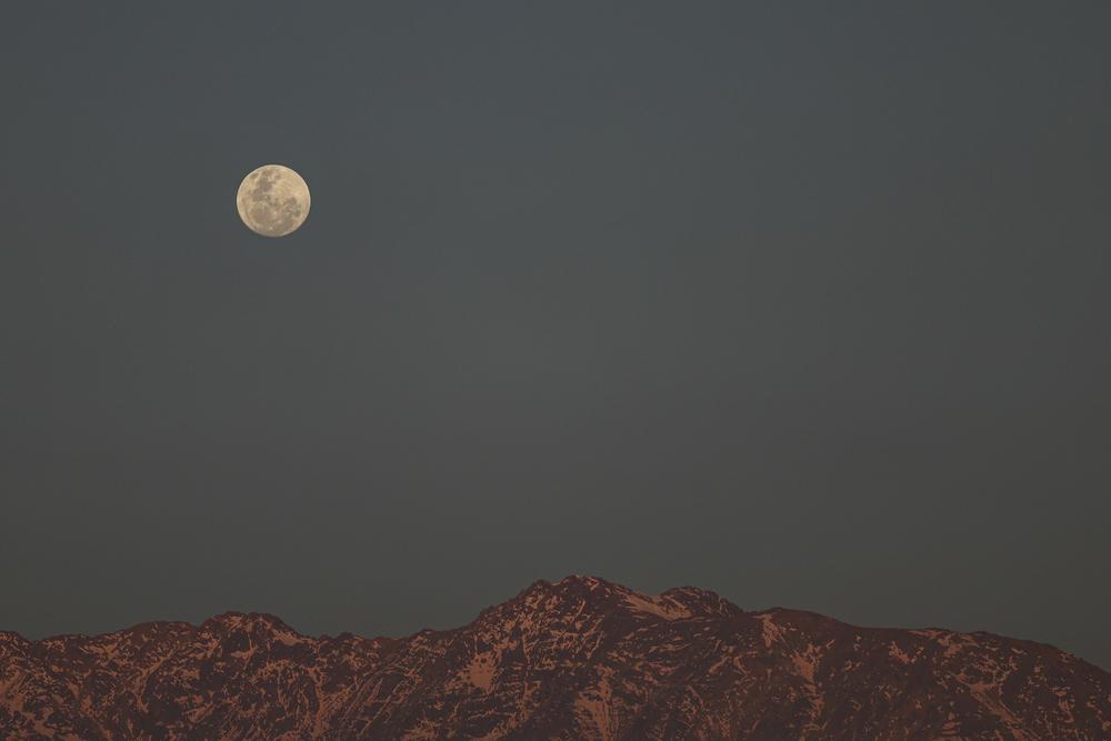 The supermoon rises over the Andes in Santiago, Chile, on Tuesday.