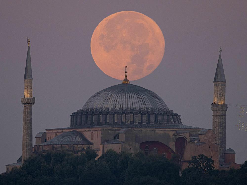 The sturgeon supermoon rises over the Hagia Sophia Grand Mosque in Istanbul on Wednesday.