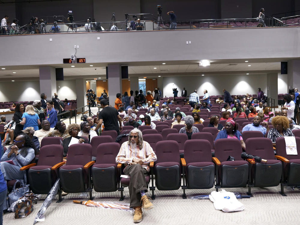 Lawmakers, teachers, school board members and parents gather for a town hall meeting on new Florida curriculum standards for Black history on Thursday in Miami Gardens, Fla.