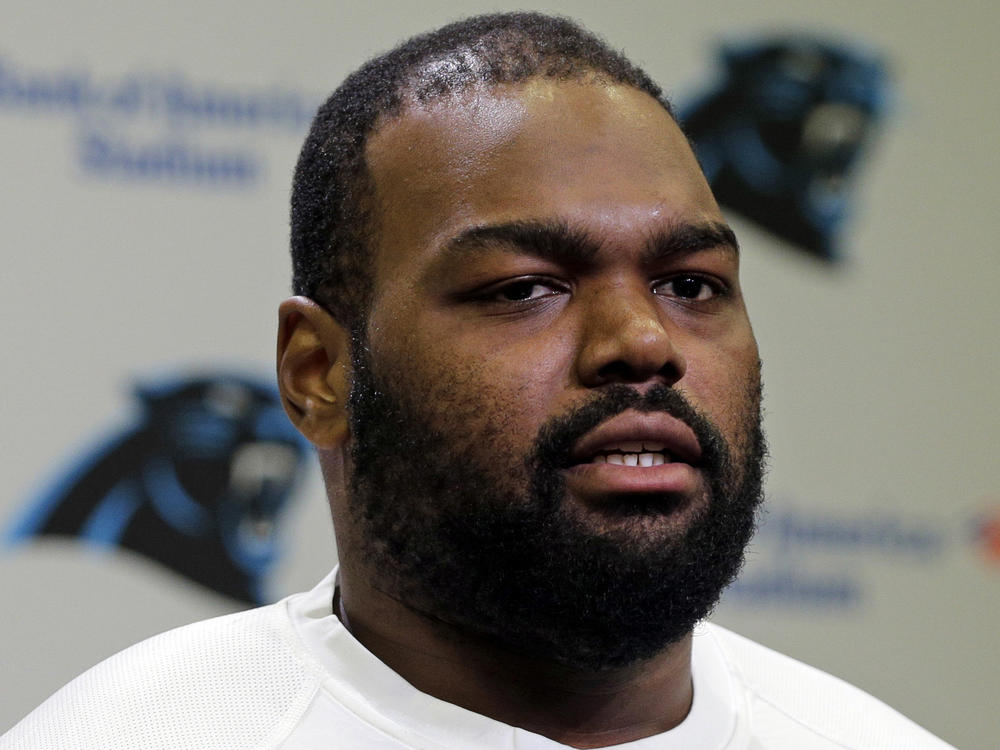 Carolina Panthers' Michael Oher speaks to the media during their NFL football offseason conditioning program in Charlotte, N.C., on April 20, 2015. Oher, the former NFL tackle known for the movie <em>The Blind Side</em>, filed a petition Monday accusing Sean and Leigh Anne Tuohy of lying to him by having him sign papers making them his conservators, not his adoptive parents, in 2004.