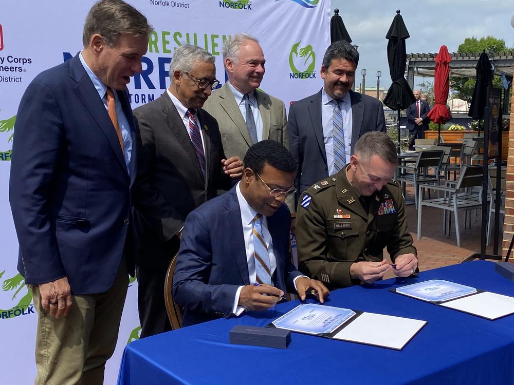 Norfolk Mayor Kenny Alexander signs a Project Partnership Agreement for the floodwall project with Col. Brian Hallberg, commander of the Army Corps' Norfolk District, in June.