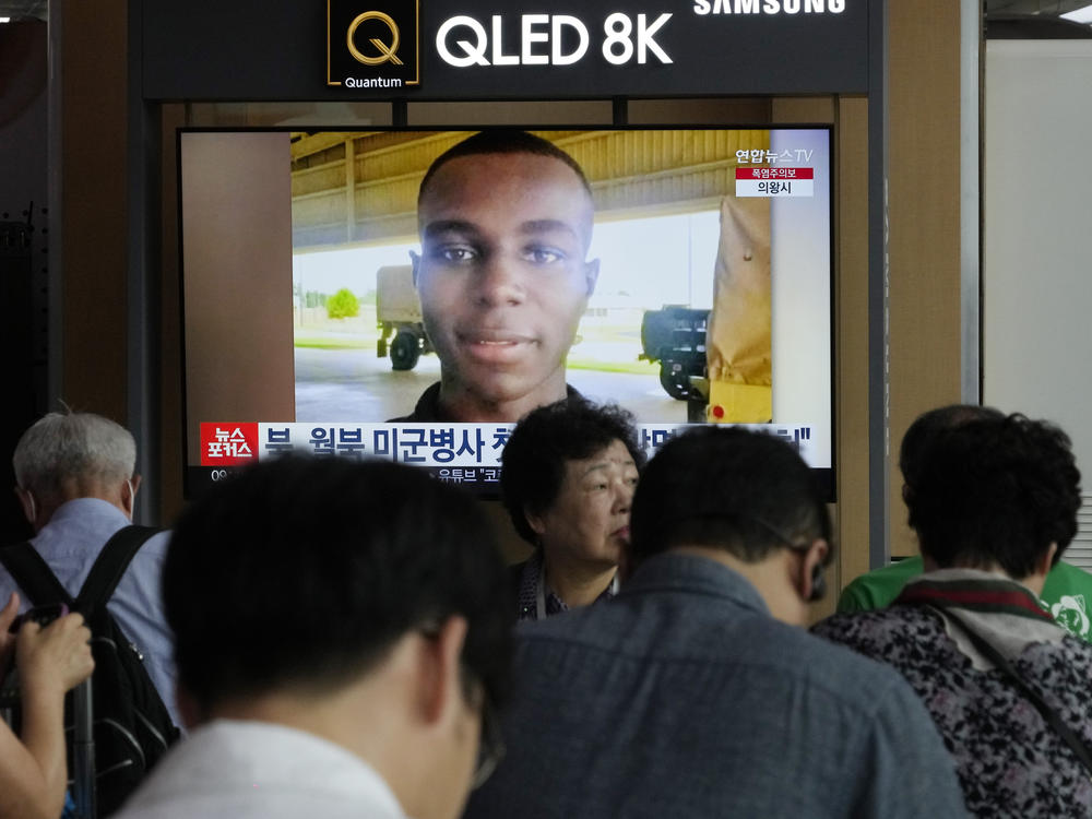 A TV screen shows a file image of U.S. soldier Travis King during a news program at the Seoul Railway Station in Seoul, South Korea, Wednesday, Aug. 16, 2023.
