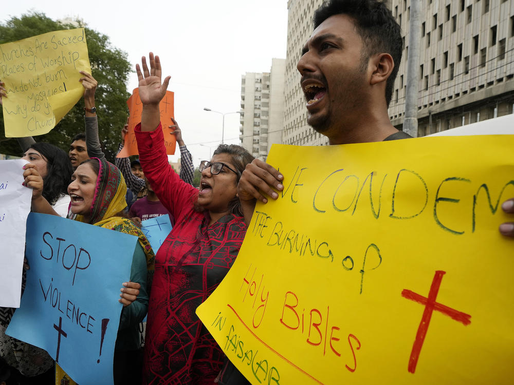 Members of Christian groups and others demonstrate in Karachi to condemn the attack on a Christian area by a Muslim mob in eastern Pakistan on Wednesday.