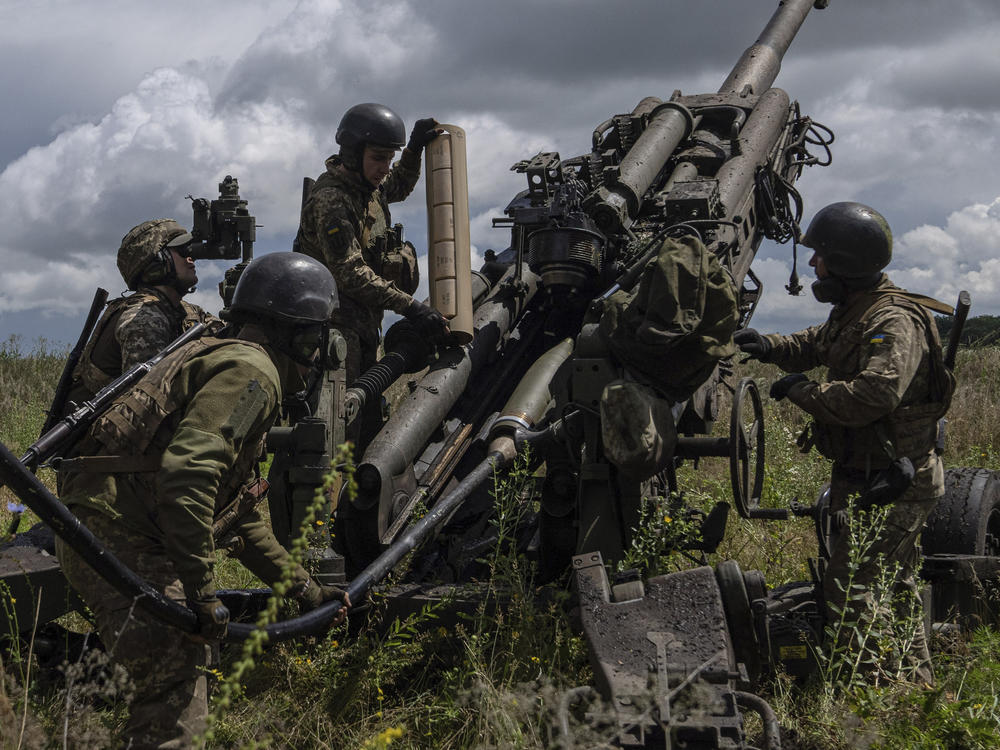 Ukrainian servicemen prepare to fire at Russian positions from a U.S.-supplied M777 howitzer in Kharkiv region, Ukraine, July 14, 2022. So far, the U.S. has supplied more than $100 billion in military, financial and humanitarian aid to help Ukraine push back Russia's invasion. (AP Photo/Evgeniy Maloletka, File)