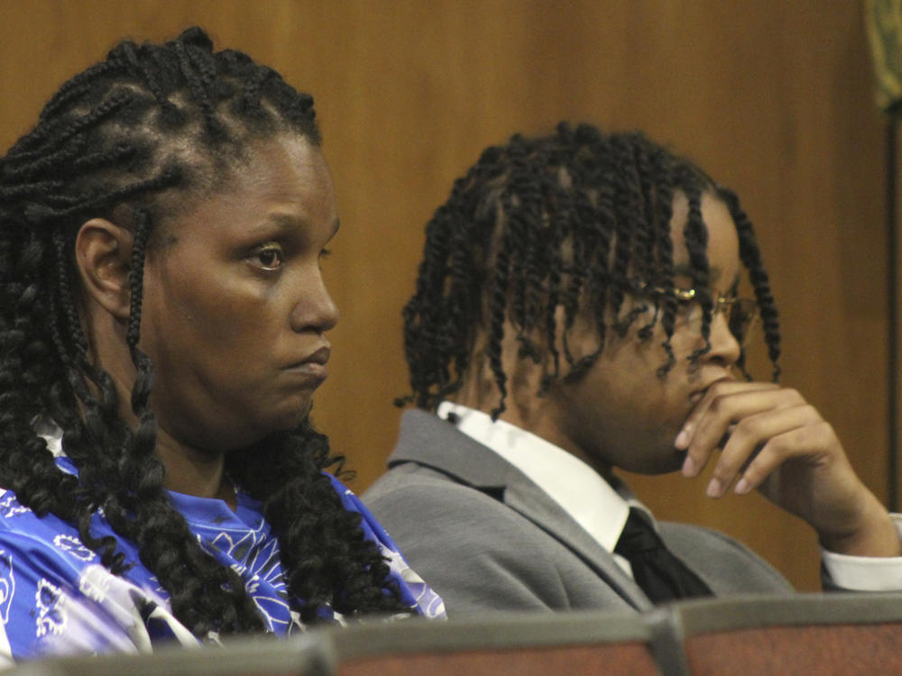 D'Monterrio Gibson, right, and his mother, Sharon McClendon, await the start of the trial of two white men charged in an attack on Gibson, a FedEx employee who was making a delivery, Thursday, Aug. 17, 2023, in Brookhaven, Miss.