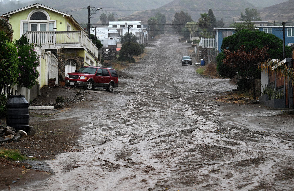 Sat., Aug. 19: A street is covered in mud as Tropical Storm Hilary makes landfall in Ensenada, Mexico Sunday.