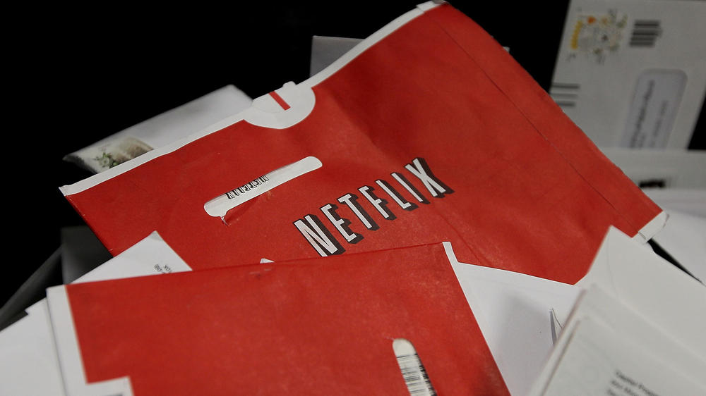 Red Netflix envelopes sit in a bin of mail at the U.S. Post Office sort center March 30, 2010 in San Francisco, California. The company is ending its DVD mailing service with a promotion.