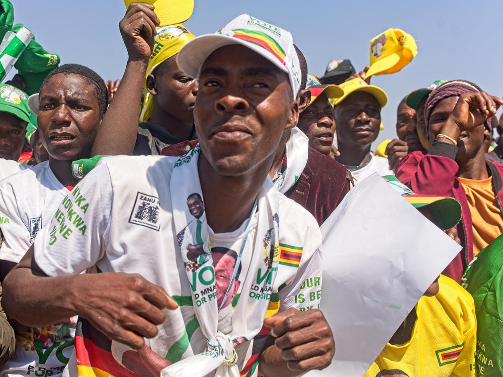 Darius Bongwe, 28, dances at President Emmerson Mnangagwa's final rally at Tongogara Business Center on Saturday ahead of Zimbabwe's general elections on Wednesday. Bongwe believes President Mnangagwa and the ruling ZANU-PF party can revive the country's economy.