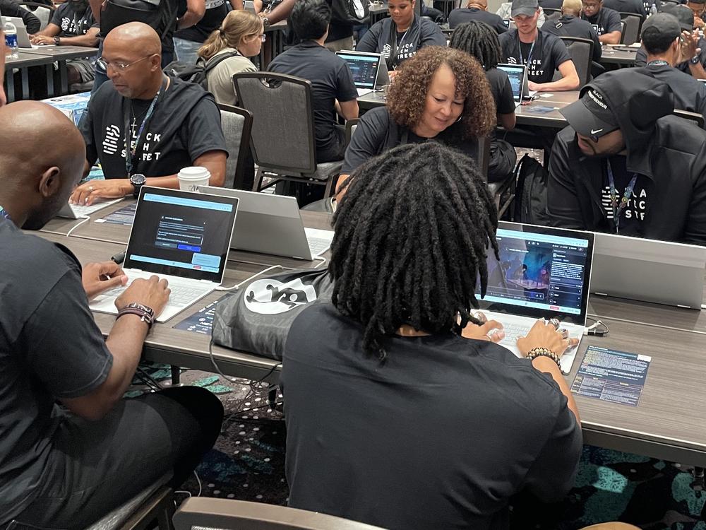 Marvin Jones (left) and Rose Washington-Jones (center), from Tulsa, Okla., took part in the AI red-teaming challenge at Def Con earlier this month with Black Tech Street.