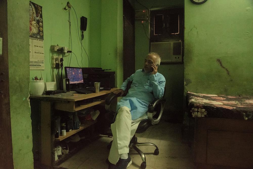 Sachdev fields calls at his desk inside the Commandos' shelter in Delhi.