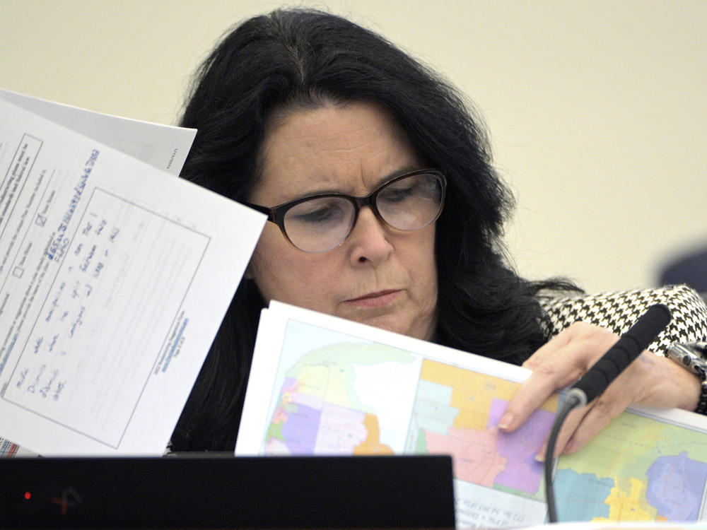 State Sen. Kelli Stargel looks through redistricting maps during a Senate Committee on Reapportionment hearing on Jan. 13, 2022, in Tallahassee, Fla. A Florida redistricting plan pushed by Gov. Ron DeSantis violates the state constitution, a state judge ruled Saturday.