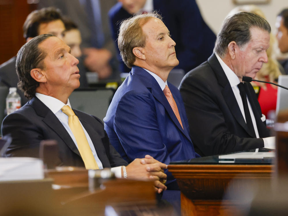 Suspended Texas AG Ken Paxton (center) sits with his legal team at the start of his impeachment trial in the Texas Statehouse. Paxton pleaded not guilty on all counts.