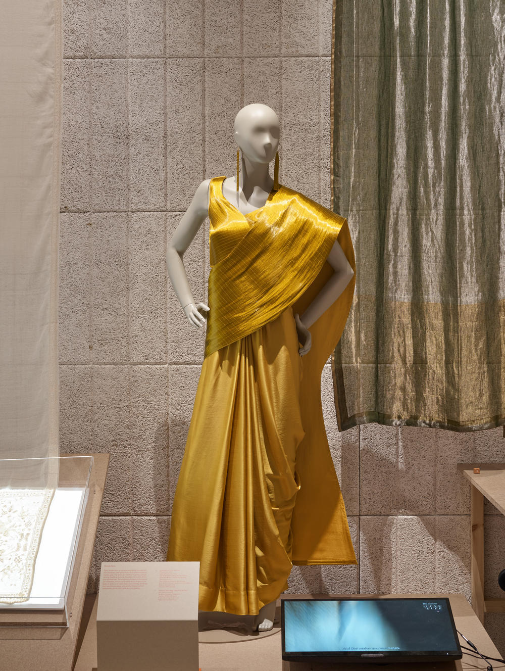 This sari is made of fine gold plated steel fibers. It's become popular among brides.