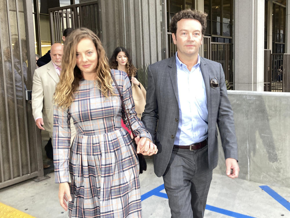 Actor Danny Masterson leaves Los Angeles superior Court with his wife Bijou Phillips after a judge declared a mistrial in his rape case in 2022.