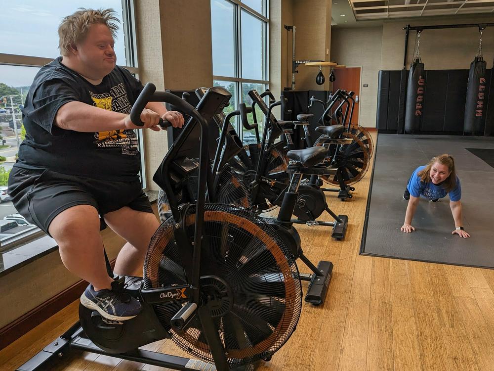 Jason Silverman, on the exercise bike, and his friend Melissa Mills go to the gym together when they hang out. The pair are part of the Friendship Project in Framingham, Massachusetts.