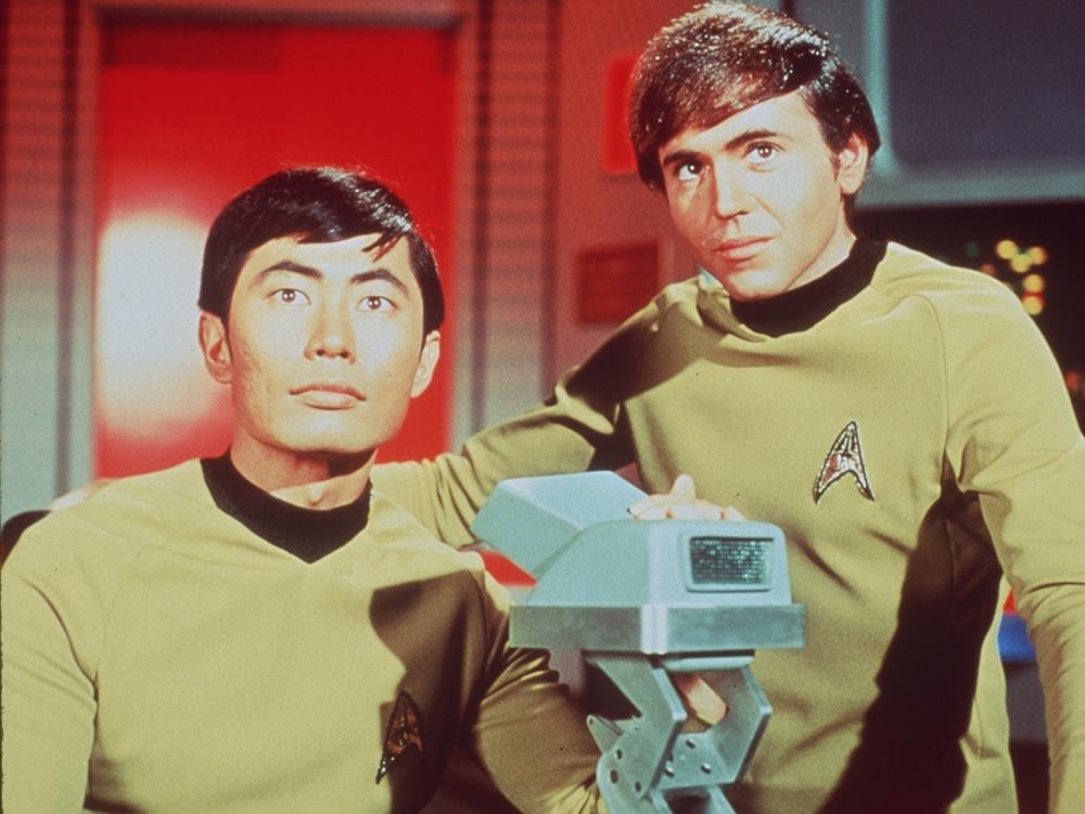 Bidders can soon vie for a tunic worn by George Takei as Lt. Sulu on the original <em>Star Trek</em> series. He's seen here at left with Walter Koenig As Lt. Chekov.