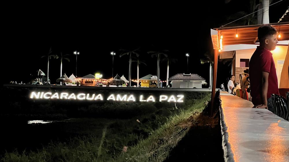 In Nicaragua, everything points to normal. On the weekends, the bars and restaurants at this lakefront pier are packed. The illuminated sign reads, 