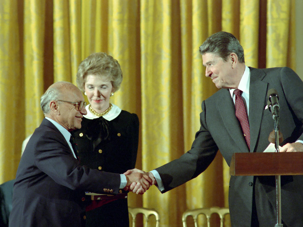 10/17/1988 President Reagan and Nancy Reagan in the East Room congratulating Milton Friedman receiving the Presidential Medal of Freedom.