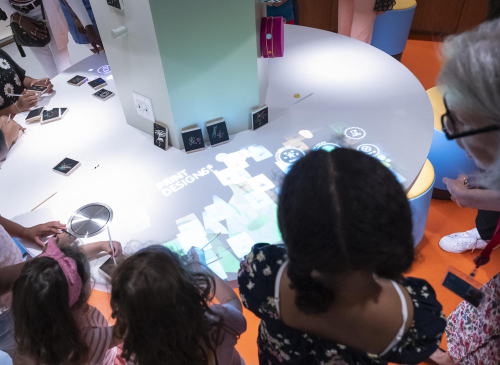 The studio space incorporates new technology. This light table lets children manipulate their own drawings.