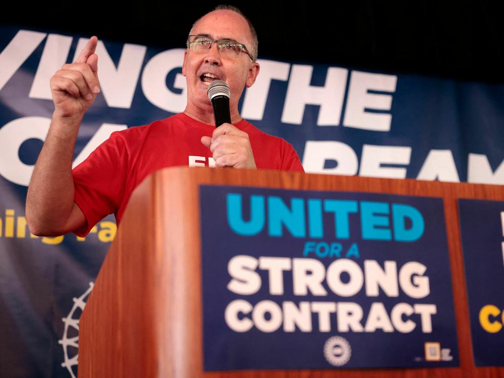UAW President Shawn Fain speaks as UAW members and their supporters gather for Solidarity Sunday at the UAW Region 1 office in Warren, Mich., on Aug. 20. The UAW has started an unprecedented strike against all three big automakers.