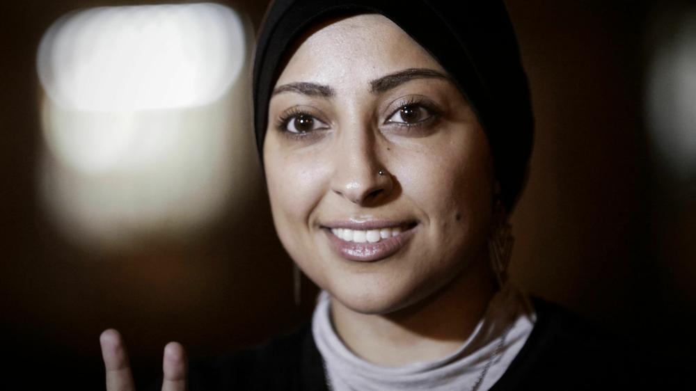 Bahrain human rights activist Maryam al-Khawaja flashes the V-sign for 