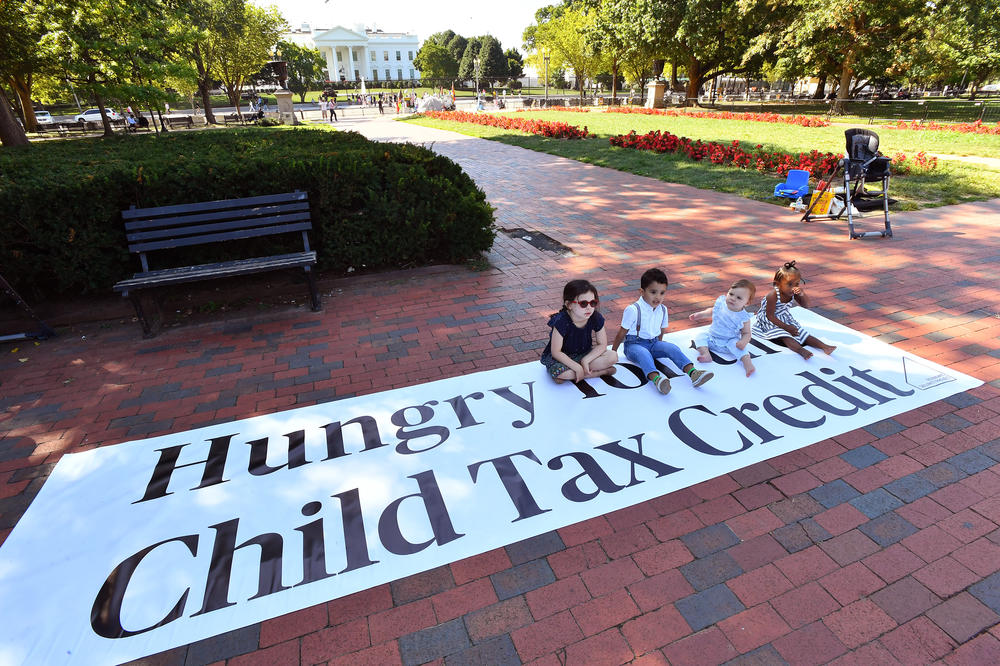 Parents and caregivers with the Economic Security Project gather outside the White House to advocate for the Child Tax Credit in September 2022.