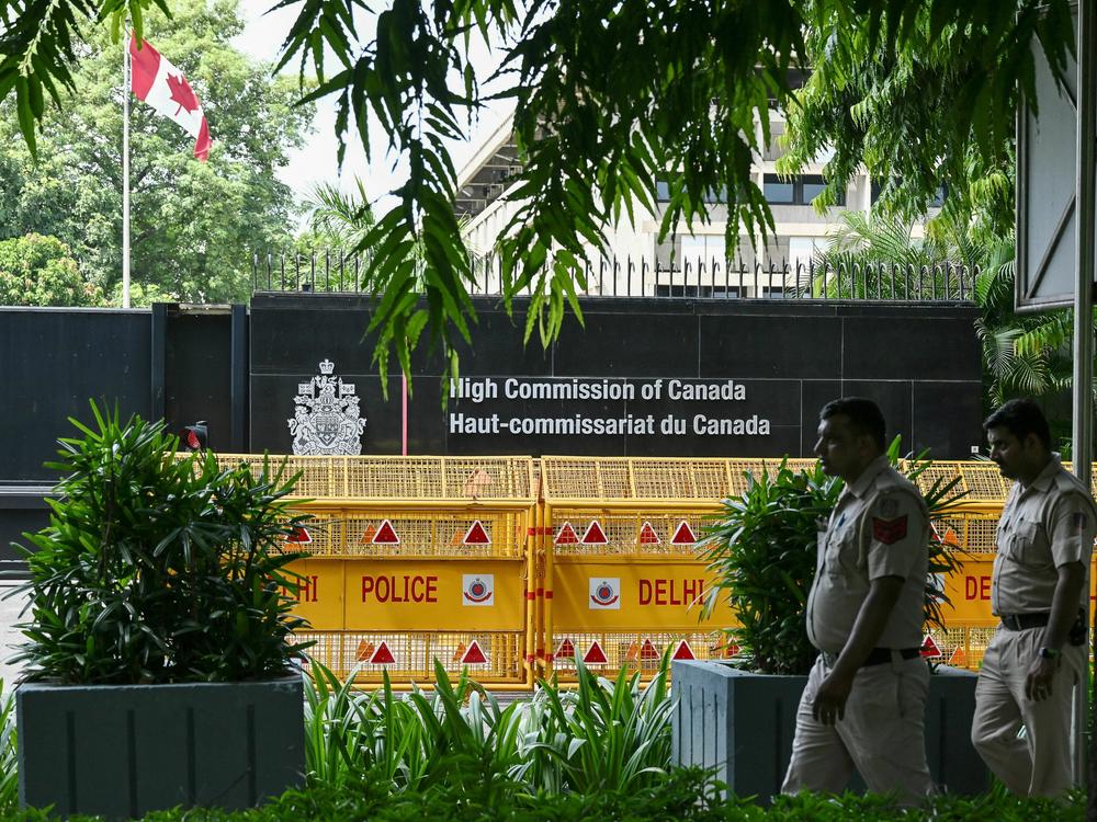 Security personnel outside the High Commission of Canada in New Delhi. Both India and Canada have expelled a diplomat as part of escalating tensions over the death of a Sikh activist in British Columbia in June.