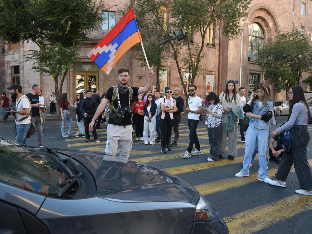 Protesters block a street in Yerevan, Armenia's capital, on Wednesday, after a cease-fire was announced between Azerbaijan and ethnic Armenians in the breakaway Nagorno-Karabakh enclave.