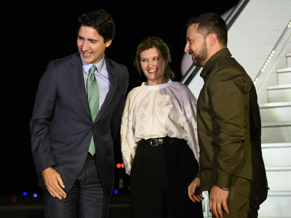 Canadian Prime Minister Justin Trudeau, left, greets Ukrainian President Volodymyr Zelenskyy and his wife Olena Zelenska, as they arrive at Ottawa Macdonald-Cartier International Airport in Ottawa, Ontario, on Thursday, Sept. 21, 2023.