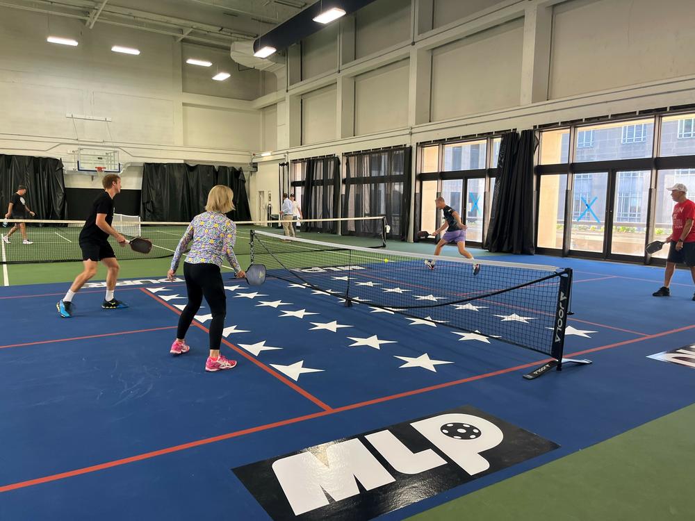 Sens. Shelley Moore Capito, R-W.Va., and Thom Tillis, R-N.C., face off in a game of pickleball in the Dirksen Senate Office Building, along with members of the D.C. professional team.