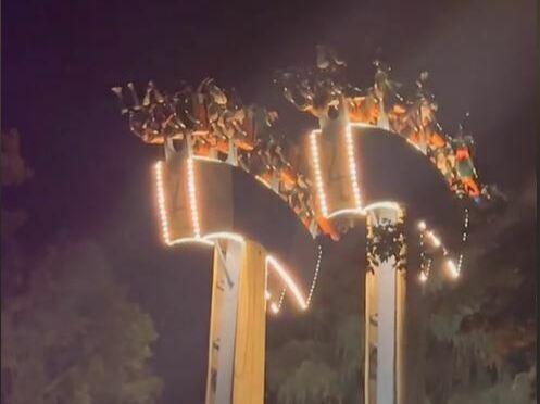 A screenshot taken from social media shows passengers dangling from the area after the abrupt stop of of the Lumberjack ride at Ontario's Wonderland theme park.