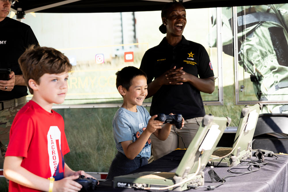 Isaiah Uy, 8, maneuvers a remote device at the Army recruitment tent at the Minnesota State Fair in Falcon Heights, Minn., on August 31.