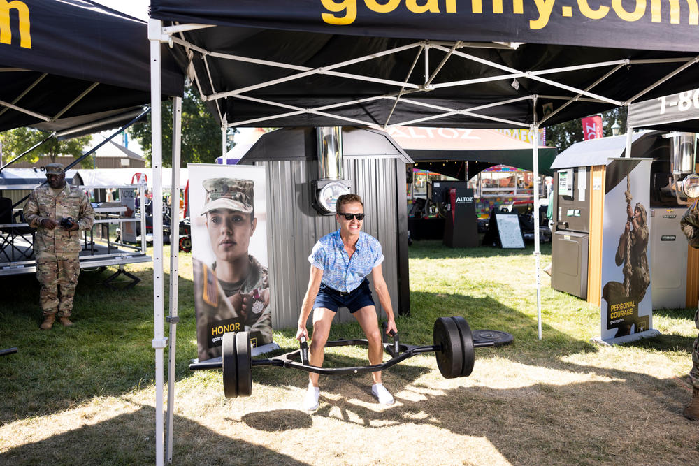 Sam Stoll stops at the Army recruitment tent for a deadlift competition at the Minnesota State Fair in Falcon Heights, Minn., on on August 31.