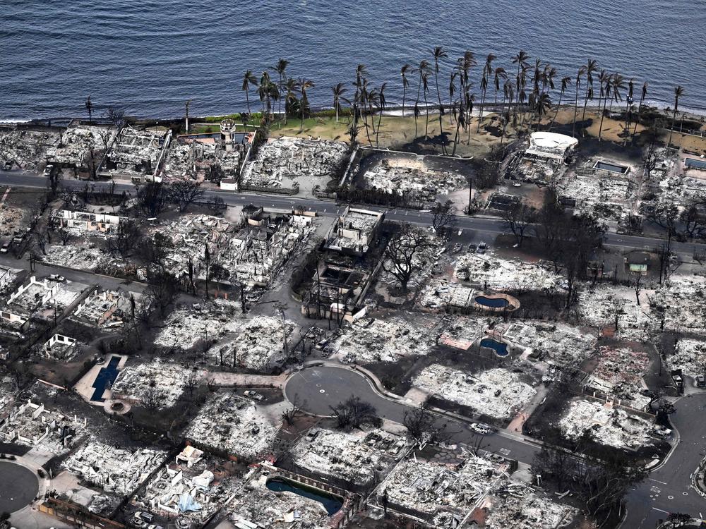 An aerial image taken on Aug. 10, 2023 shows destroyed homes and buildings burned to the ground in Lahaina in the aftermath of wildfires in western Maui, Hawaii. Rumors and conspiracy theories quickly flourished after the fire, hampering relief efforts.