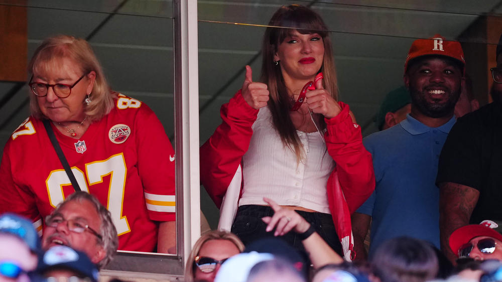 Donna Kelce, wearing her son Travis' No. 87 jersey, and Taylor Swift are seen during the Kansas City Chiefs' game with the Chicago Bears in Kansas City, Missouri. Sales of Kelce's jersey soared after Swift appeared at the game.