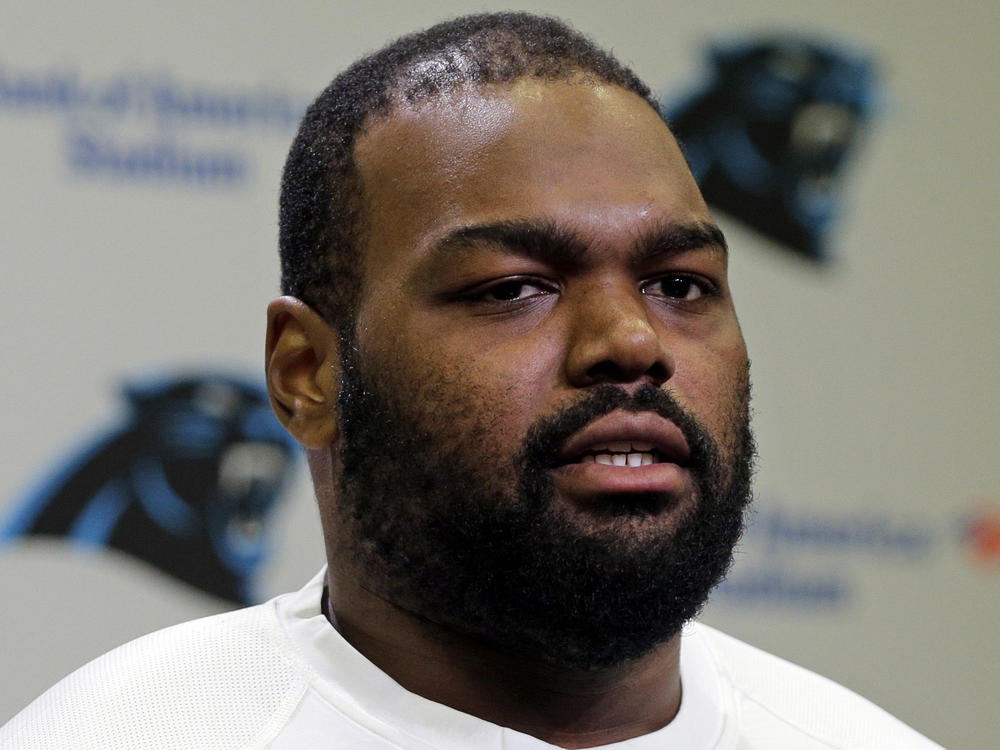 Michael Oher speaks to the media during the first day of the Carolina Panthers' offseason conditioning program in Charlotte, N.C., April 20, 2015. Oher, the former NFL tackle known for the movie 