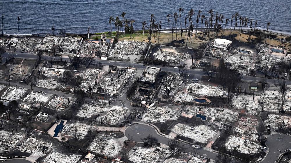 An aerial image taken on Aug. 10, 2023 shows destroyed homes and buildings burned to the ground in Lahaina in the aftermath of wildfires in western Maui, Hawaii. Rumors and conspiracy theories quickly flourished after the fire, hampering relief efforts.