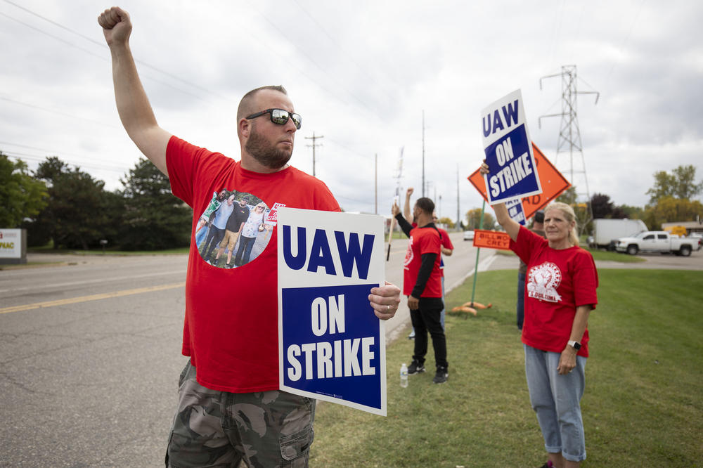 United Auto Workers members strike the General Motors Lansing Delta Assembly Plant on Friday in Lansing, Michigan.