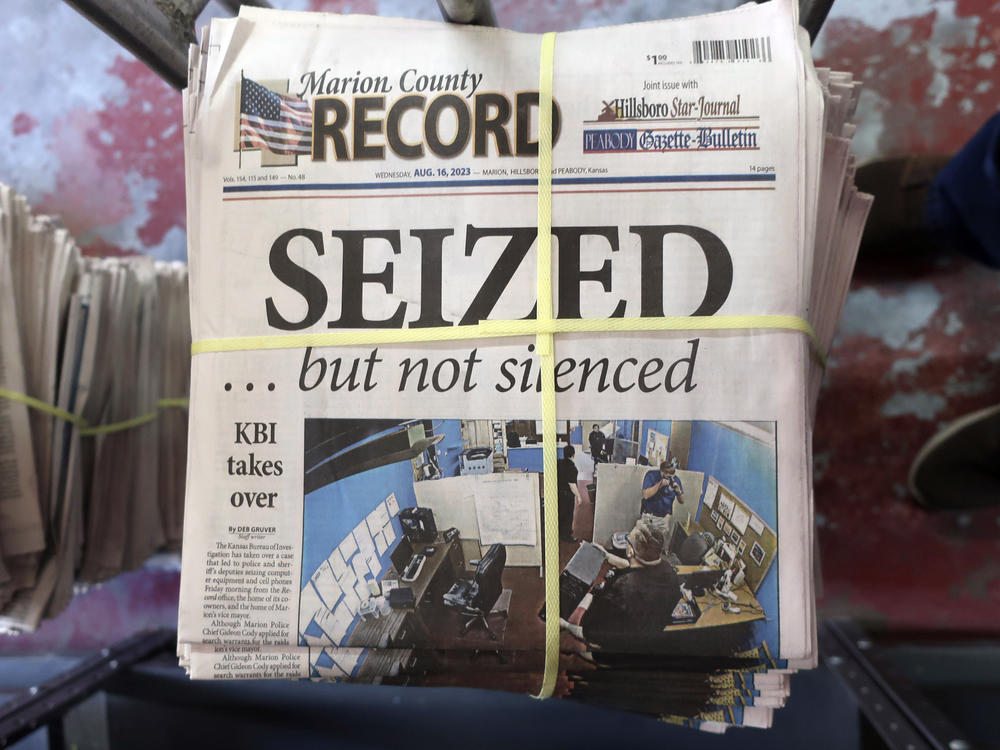 A stack of the Marion County Record sits in the back of the newspaper's building, awaiting unbundling, sorting and distribution on Aug. 16, 2023, in Marion, Kan.