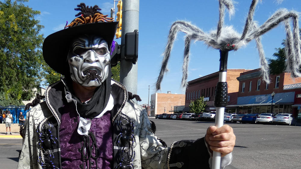 The self dubbed Arachnid King and tarantula fan, Charlie Fox, shows off his spider themed costume after marching in La Junta's annual Tarantula Festival parade