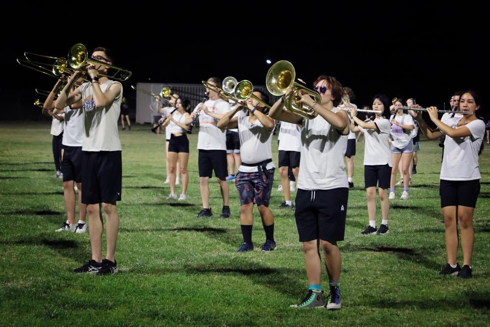 Mountain Ridge High School near Phoenix starts marching band practice at 7 p.m. to beat the heat of the day. Band members also wear light clothing and take frequent water breaks.