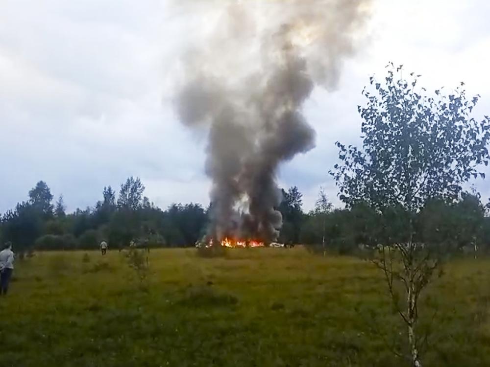In this image taken from video, smoke rises from the crash of a private jet near the village of Kuzhenkino in the Tver region of Russia, on Aug. 23. Mercenary leader Yevgeny Prigozhin, head of the Wagner Group, and his top lieutenants were among the 10 people killed in the crash northwest of the Russian capital.