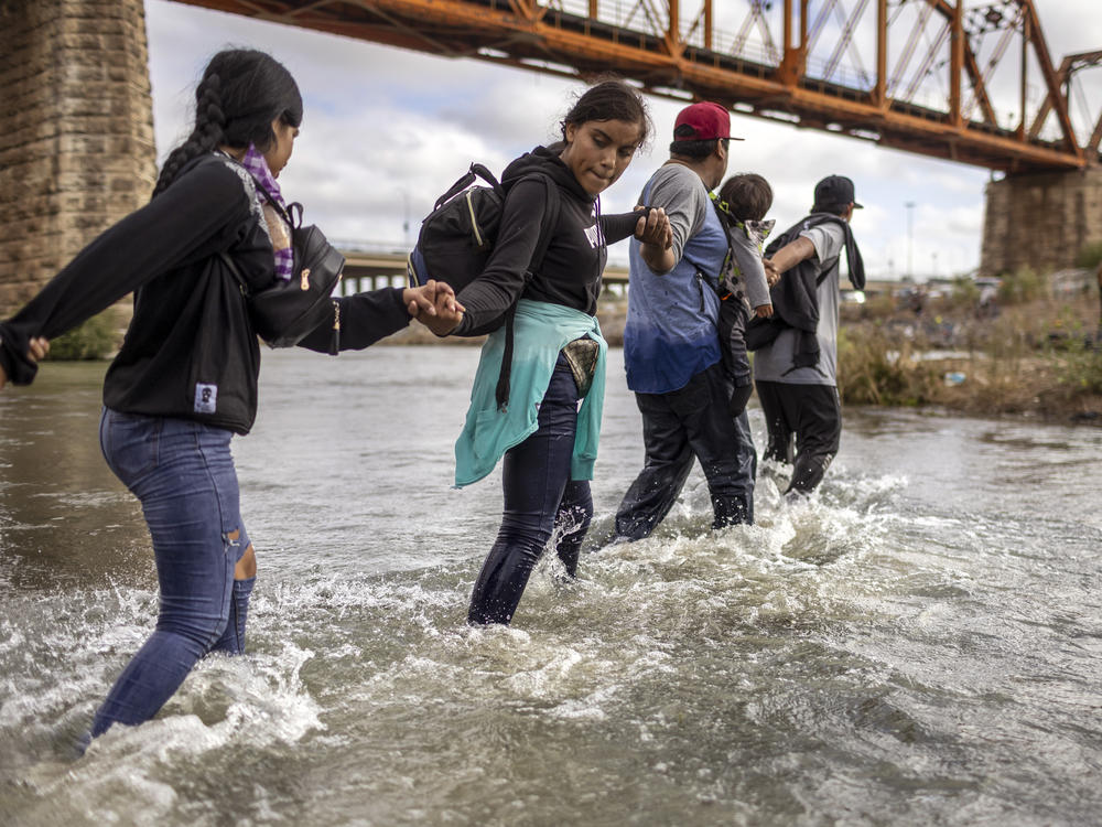 Immigrants from Venezuela crossed the Rio Grande from Mexico into the U.S. last month in Eagle Pass, Texas.