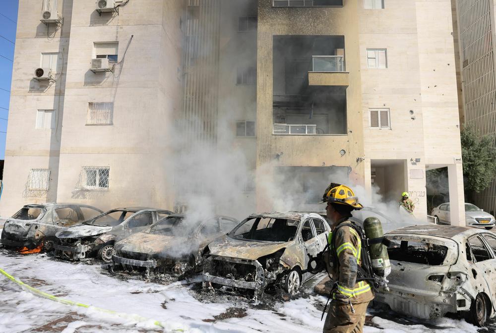 Sat., Oct. 7: Israeli fire brigade teams douse the blaze in a partking lot outside a residential building following a rocket attack from the Gaza Strip in the southern Israeli city of Ashkelon.