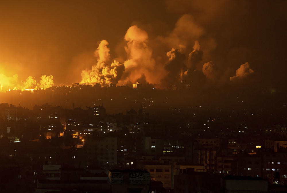 Sun., Oct. 8: Fire and smoke rise following an Israeli airstrike, in Gaza City.